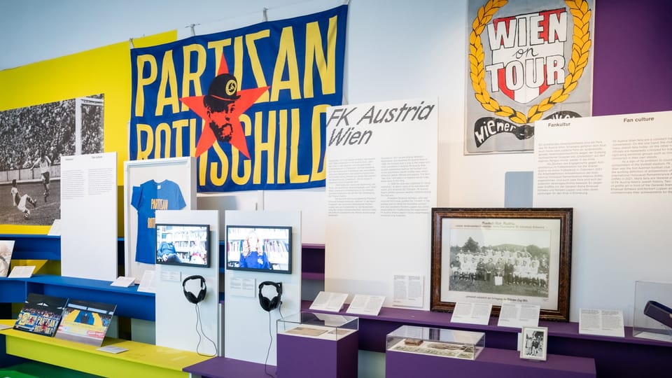 Exhibition with fan items, text panels and video screens