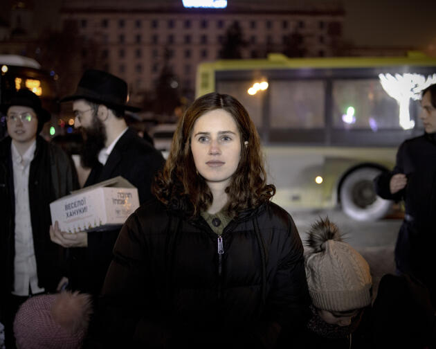 A Ukrainian woman attends Hanukkah celebrations in downtown Dnipro, Ukraine, December 10, 2023.