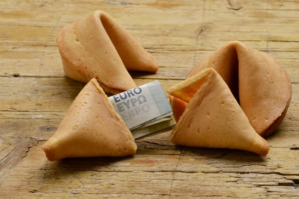 Packing gifts of money: fortune cookies with banknotes