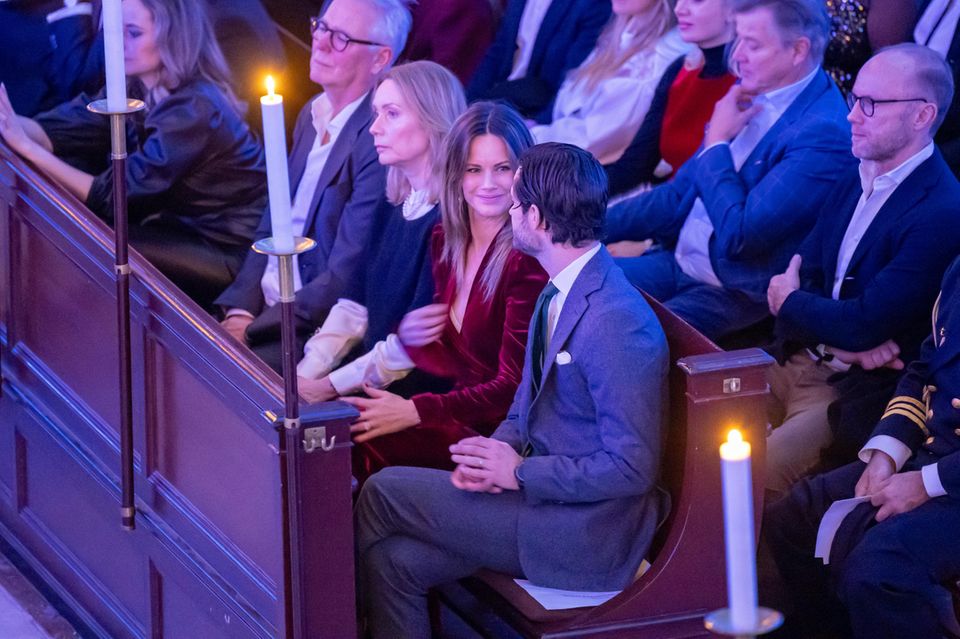 Noticed!  The Swedish princess quickly adjusts her neckline during the concert. 