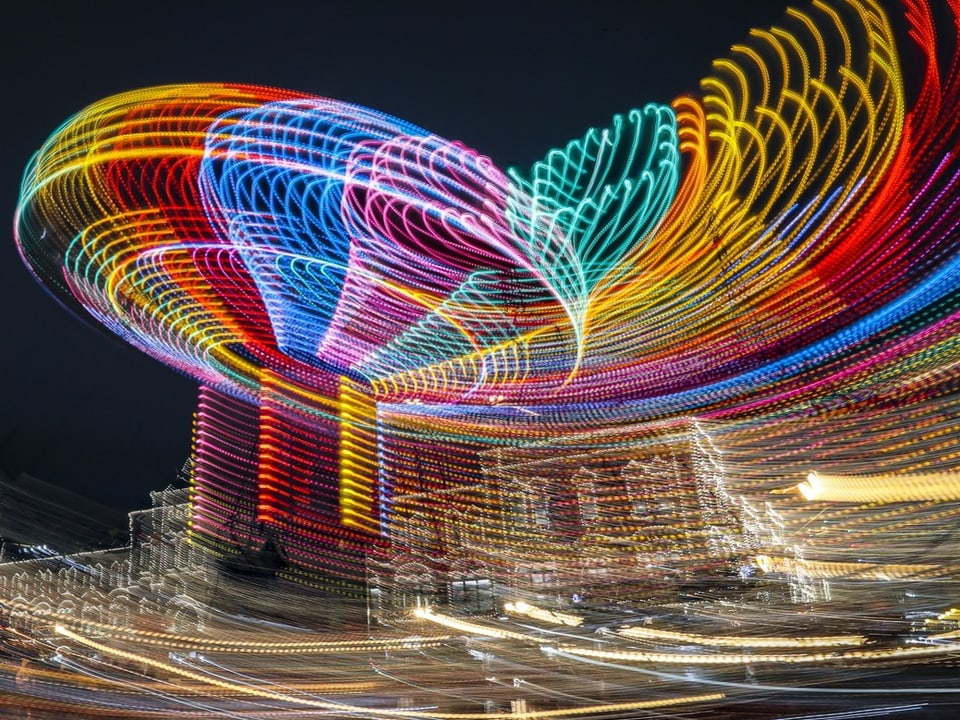 The colors of a carousel in a photograph.
