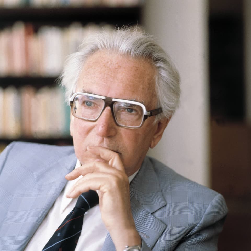 Viktor Frankl looks into the distance, thinking
