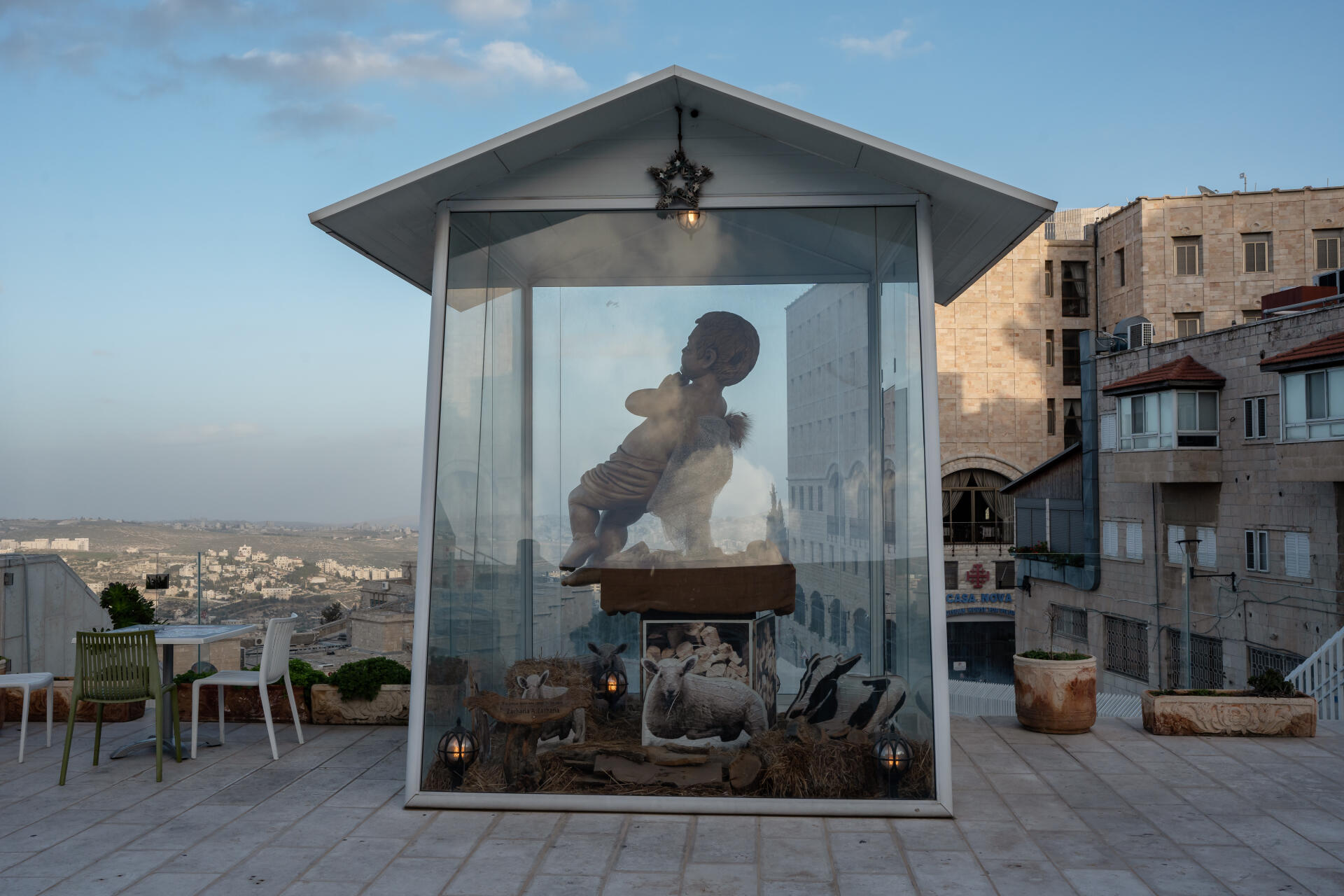 A sculpture of the baby Jesus on the empty terrace of a restaurant in Bethlehem, West Bank, December 22, 2023. 