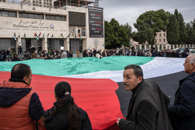 A Palestinian flag is displayed in Manger Square, in Bethlehem, West Bank, December 24, 2023. 