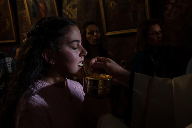 In the Grotto, believed to be the birthplace of Christ, worshipers take turns praying and singing under the Church of the Nativity, in Bethlehem, West Bank, December 25, 2023. 