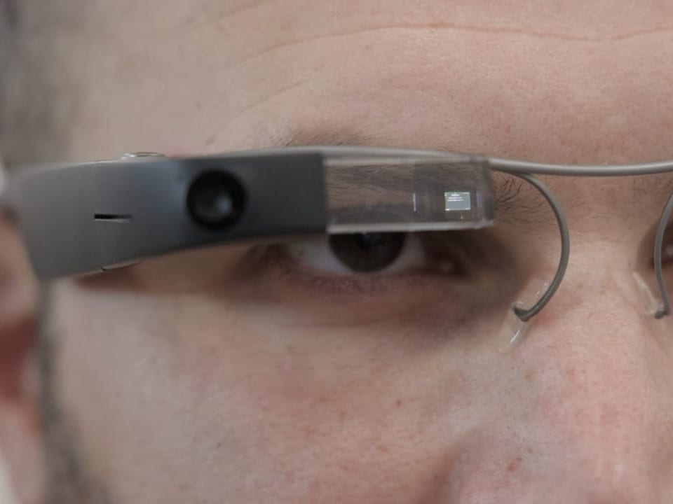 Close-up of logistician with high-tech glasses on