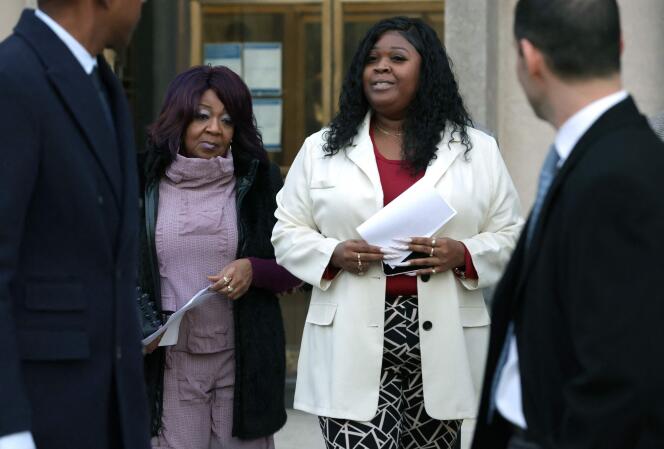 Ruby Freeman (left) and her daughter Wandrea Shaye Moss leave court in Washington on December 15, 2023.
