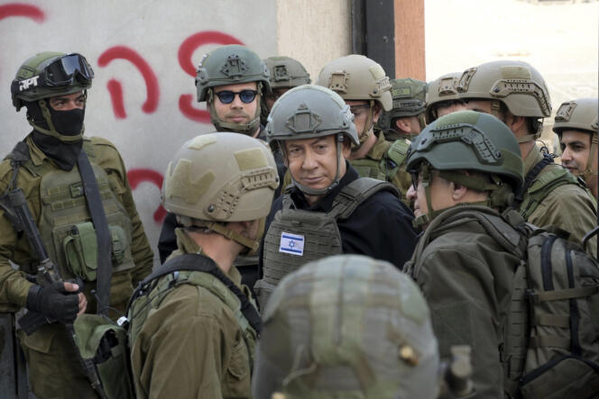 Israeli Prime Minister Benjamin Netanyahu receives a security briefing with commanders and soldiers in the northern Gaza Strip, December 25, 2023. 