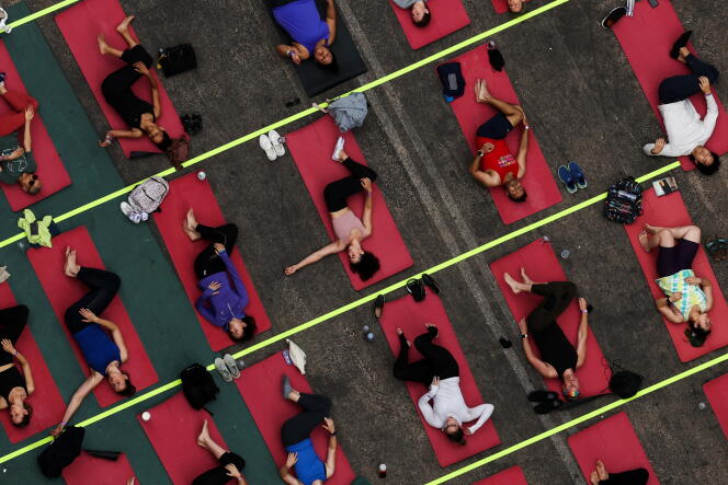 A giant yoga session in Times Square, New York, on June 21, 2023.
