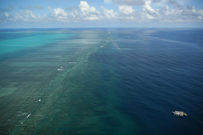 A Philippine fishing vessel (bottom right) near Scarborough Reef, September 2023.