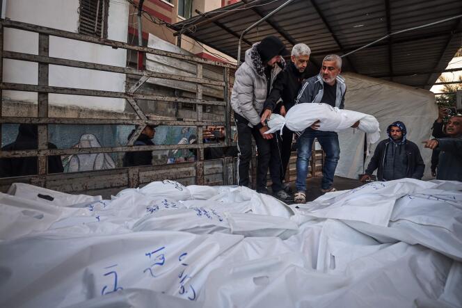 Bodies of Palestinian victims of bombings in Rafah loaded into a truck, December 29, 2023, before their burial.