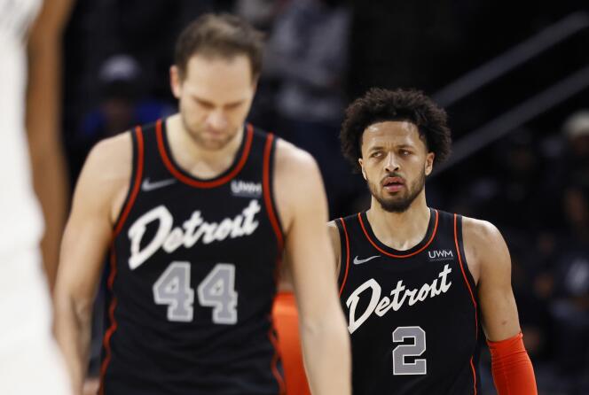 Bojan Bogdanovic and Cade Cunningham of the Detroit Pistons on December 26, 2023 during the game against the Brooklyn Nets in Detroit.