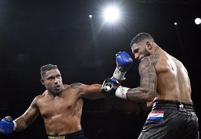 Frenchman Tony Yoka (right) and Belgian Ryad Merhy during their heavyweight boxing fight at the Roland-Garros complex in Paris on December 9, 2023.
