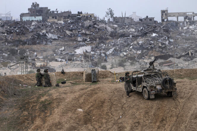 Israeli army vehicles and soldiers near the border of the Gaza Strip, southern Israel, Saturday, December 23, 2023. 