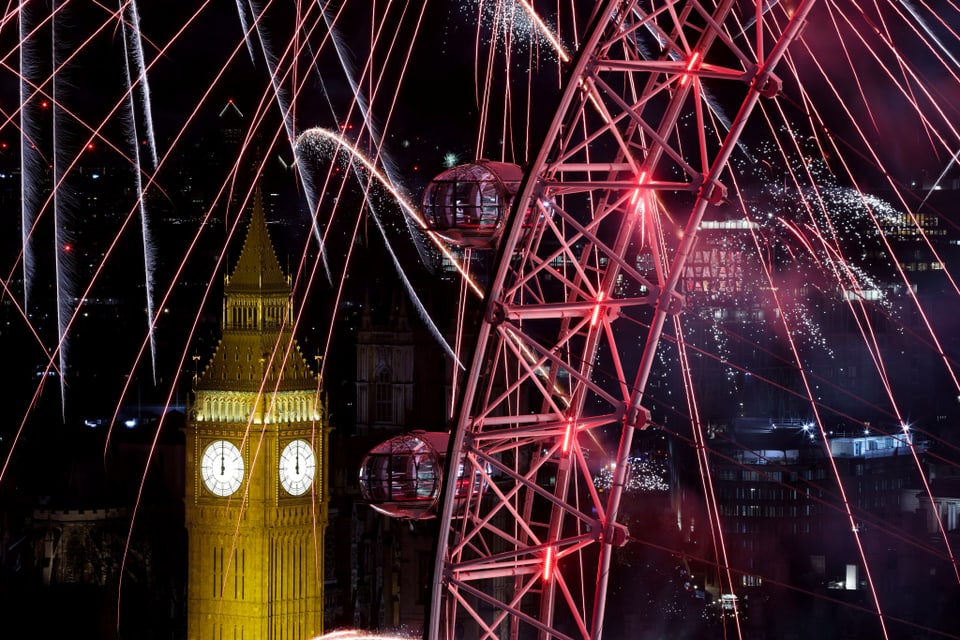 Fireworks over Big Ben and the London Eye.