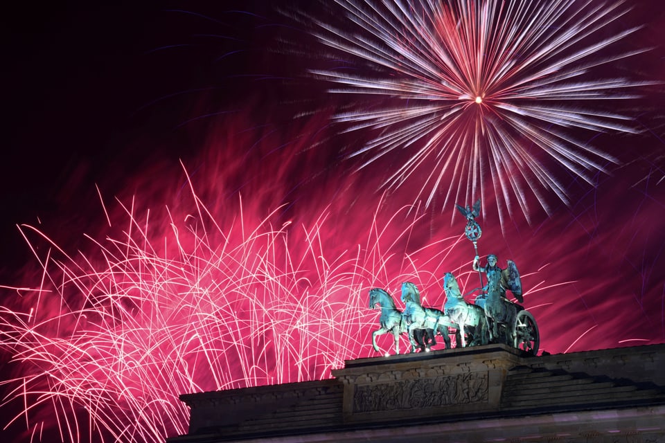 Fireworks over the Brandenburg Gate.