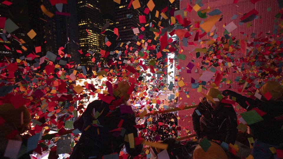 Confetti flies in New York's Times Square at midnight.