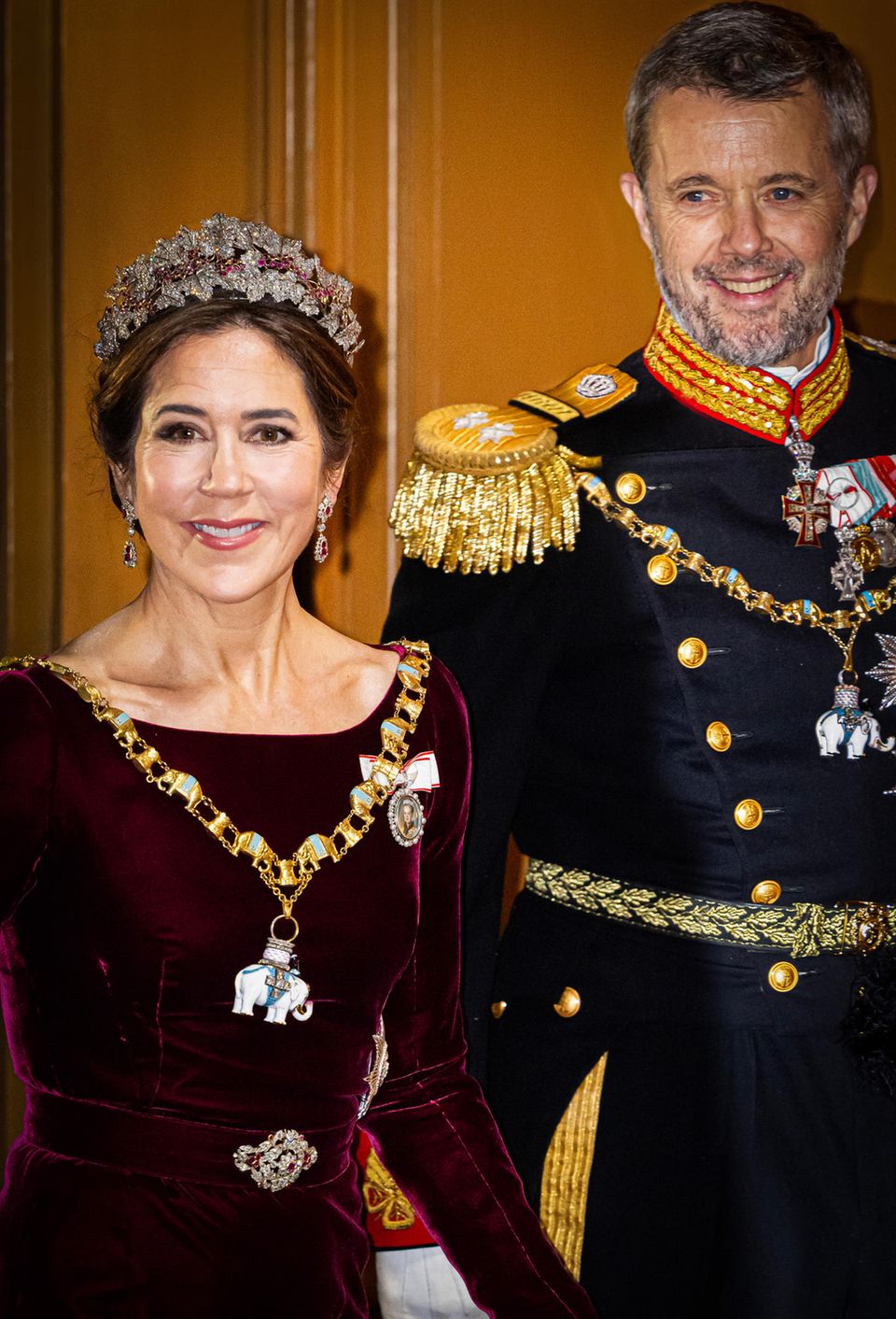 2024: Crown Princess Mary wears Birgit Hallstein's dress and combines it with the Ruby Parure tiara. 