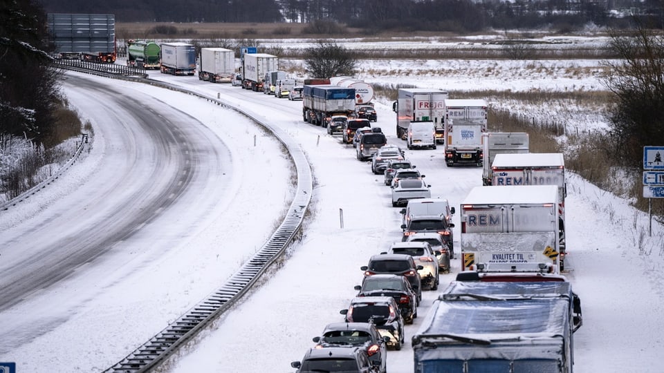 Trucks and cars stand on the E45 motorway near Randers, Jutland Peninsula, Denmark, on January 4th, 2024.