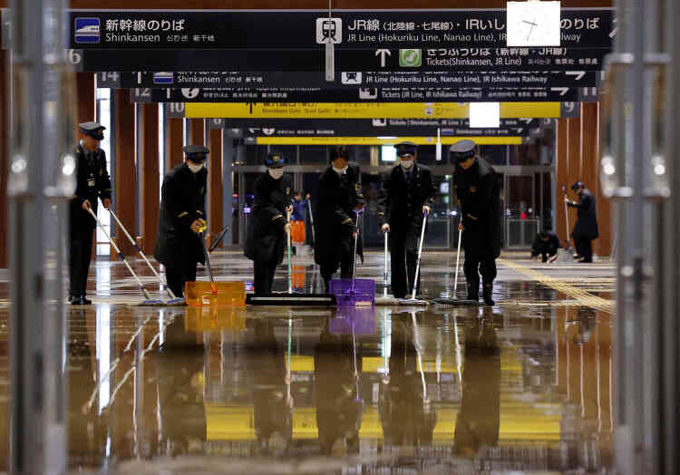 Railway workers evacuate water following broken pipes at Kanazawa Station, the capital of Ishikawa Prefecture, Japan, January 1, 2024.
