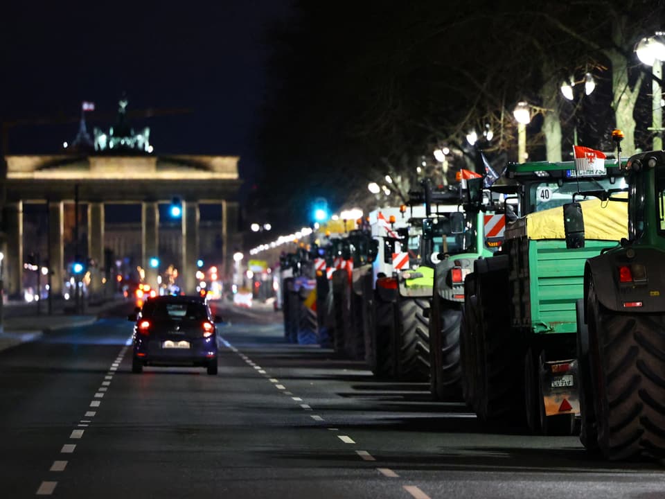 Tractors line up near the Brandenburg Gate.
