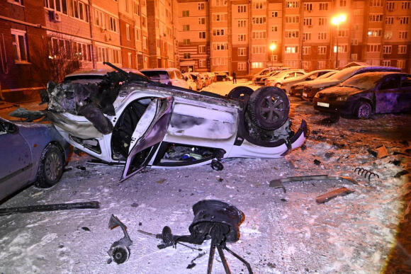 Damaged cars in the courtyard of an apartment building, after what local authorities called a Ukrainian military attack, in the city of Belgorod, Russia, photo released January 5, 2024.