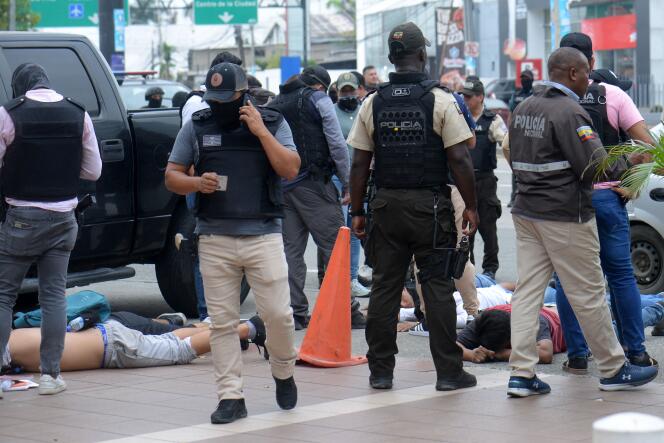 Ecuadorian police officers and suspects arrested after the assault at the studios of Ecuadorian channel TC Television, in Guayaquil, on January 9, 2024, as the president declared a state of emergency.
