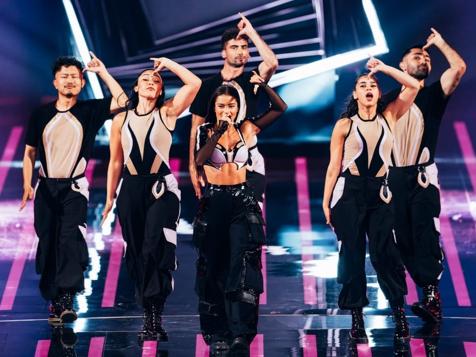 The Israeli singer performs surrounded by dancers in the ESC final