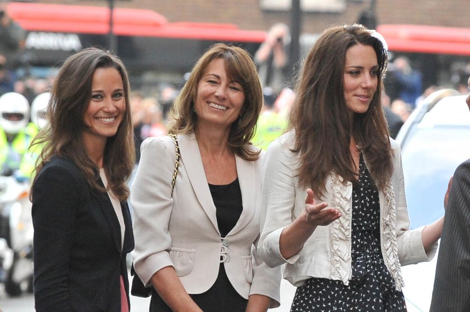 Duchess Catherine (right) with mother Carole Middleton (center) and sister Pippa Matthews (left)