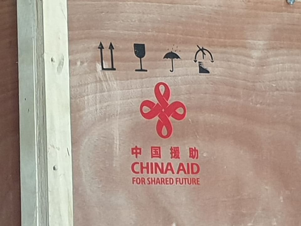 Wooden box with the inscription: “China Aid”