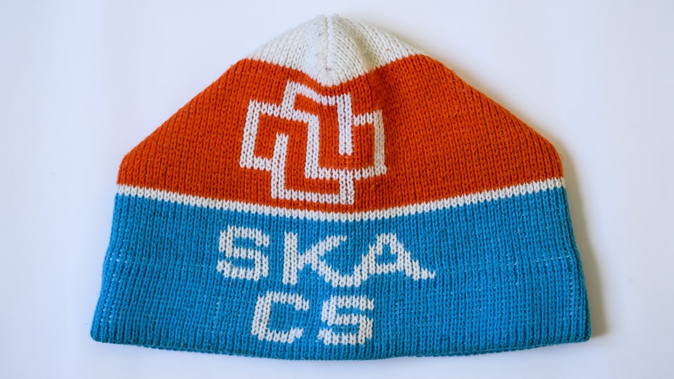 A red, blue, white cap with the inscription SKA CS