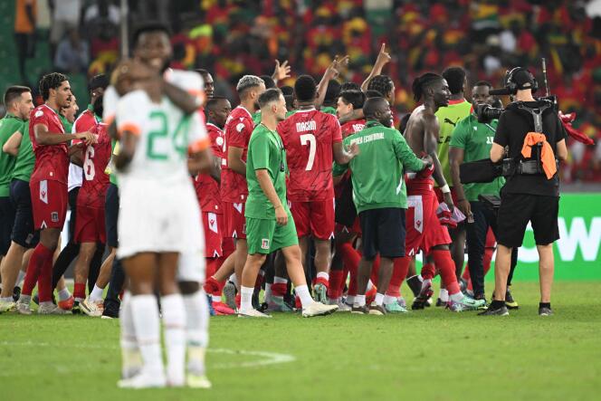 Equatorial Guineans celebrate their team's victory against Ivory Coast, at the Alassane Ouattara Olympic stadium in Ebimpe (Ivory Coast), January 22, 2024.