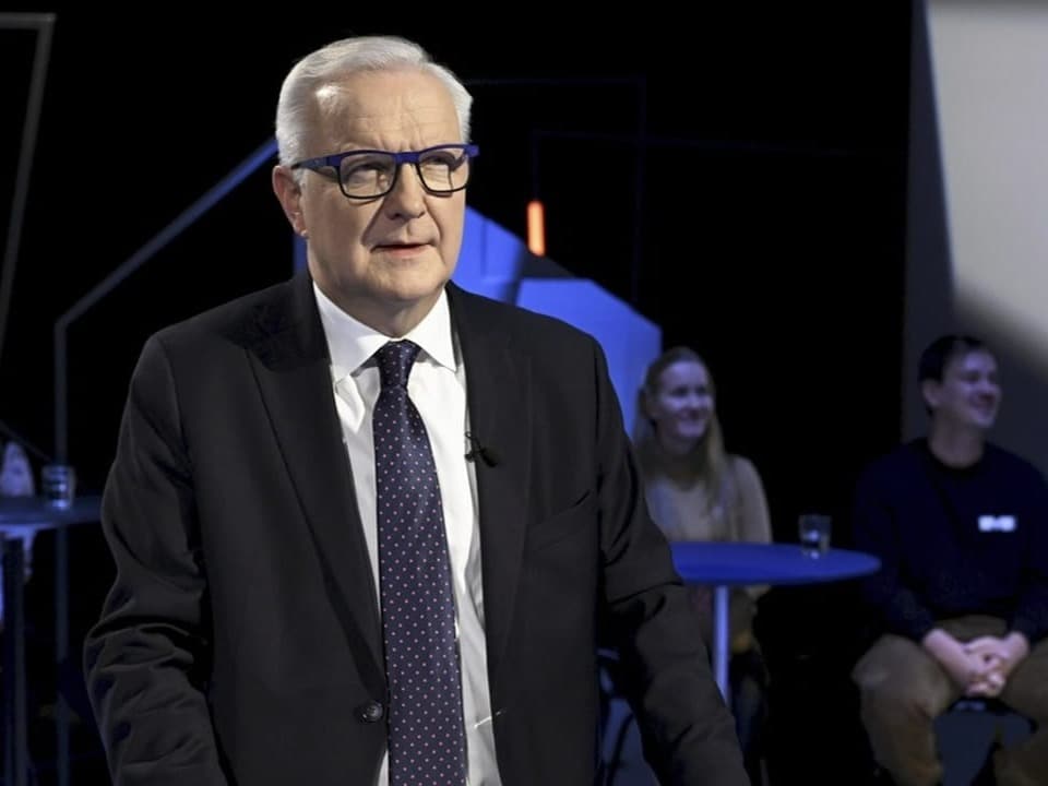 Olli Rehn speaks at a presidential election debate.