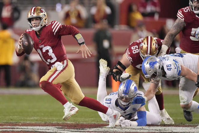 49ers quarterback Brock Purdy escapes with the ball against the Detroit Lions on January 28, 2024 in San Francisco (California).