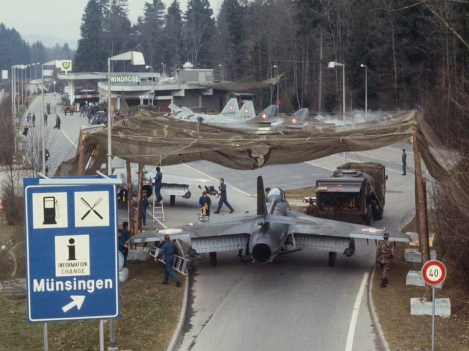 Fighter jet rolls over the entrance to the motorway service station