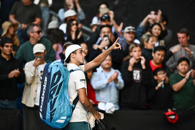 Arthur Cazaux reacts to the applause of spectators, after his defeat against the Pole Hubert Hurkacz in the round of 16 of the Australian Open tennis tournament, in Melbourne, January 22, 2024. 