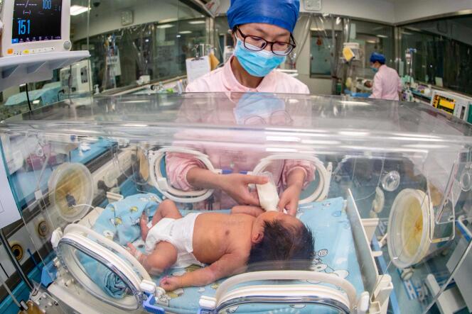 A nurse takes care of a newborn baby at a hospital in Taizhou, east China's Jiangsu Province, May 12, 2023.