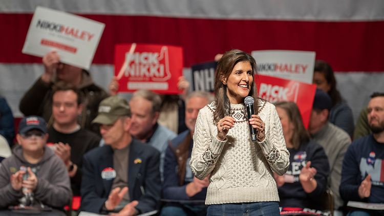 Close to the people in jeans and a sweater - Nikki Haley at a campaign speech in Exeter, New Hampshire.  Trump's last remaining opponent in the Republican primary must win in New Hampshire on Tuesday to have any chance of running.
