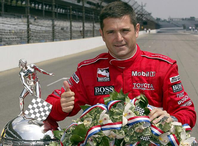 Racing driver Gil de Ferran poses with the Indianapolis 500 trophy, May 26, 2003.