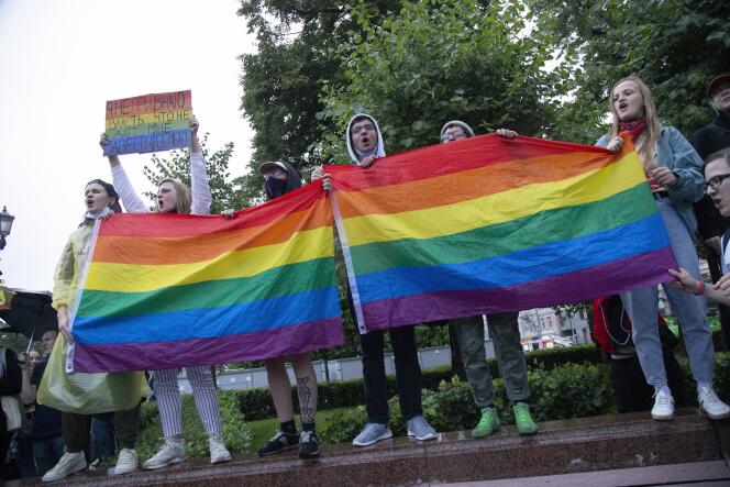 LGBT activists wave their flags during a rally to overturn the results of the vote on amendments to the Constitution in Moscow, Russia, July 15, 2020.
