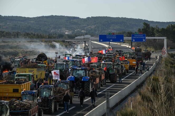 Farmers protest with tractors to block the A9 motorway, near the Narbonne Sud tollbooth, on January 26.
