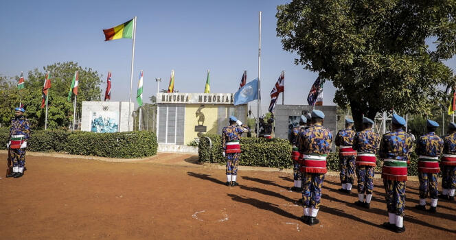 Minusma troops lower the UN flag before their departure from Bamako, December 11, 2023.