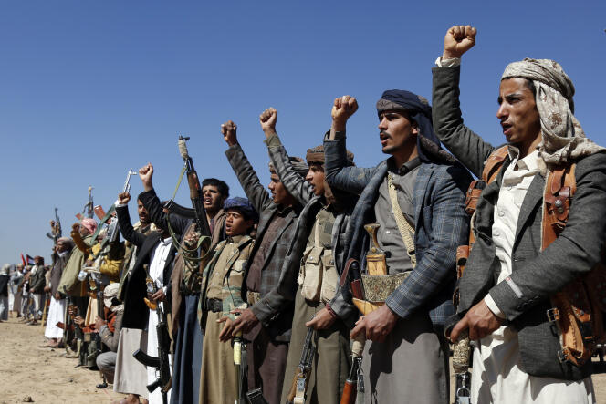 Houthi fighters demonstrate against American and British strikes near Sanaa, Sunday January 14, 2024. 