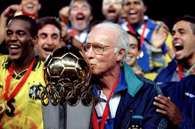 Brazilian coach Mario Zagallo kisses the South American Olympic Football Championship cup, surrounded by his team, March 6, 1996. 