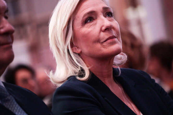 Marine Le Pen, president of the National Rally (RN) group in the Assembly, attends greetings to the press from Jordan Bardella, president of the RN, in Paris, January 15, 2024.