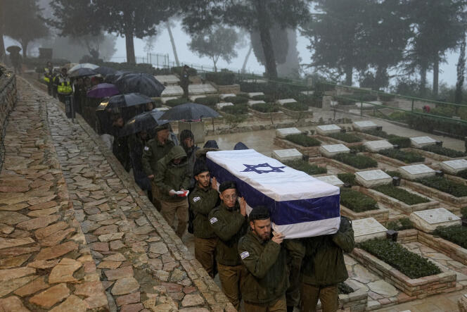 Israeli soldiers carry the coffin of Elkana Vizel, a 35-year-old reservist, at the Mount Herzl military cemetery in Jerusalem, January 23, 2024. 