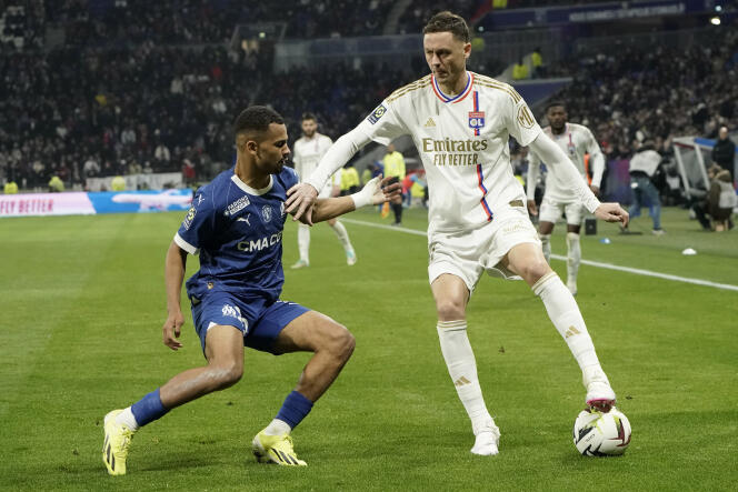 Lyon defensive midfielder Nemania Matic (right) and Marseille attacking midfielder Iliman Ndiaye during the Ligue 1 match between Olympique Lyonnais and Olympique de Marseille, in Lyon, February 4, 2024.