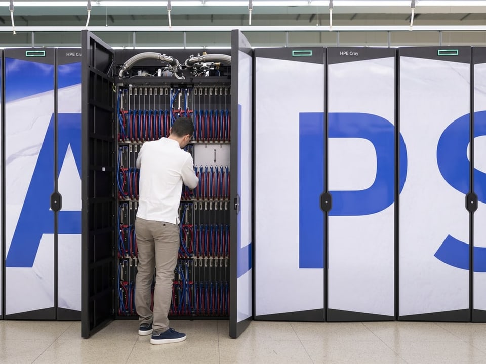 An employee works on the Alps supercomputer at the national high-performance computing center CSCS 