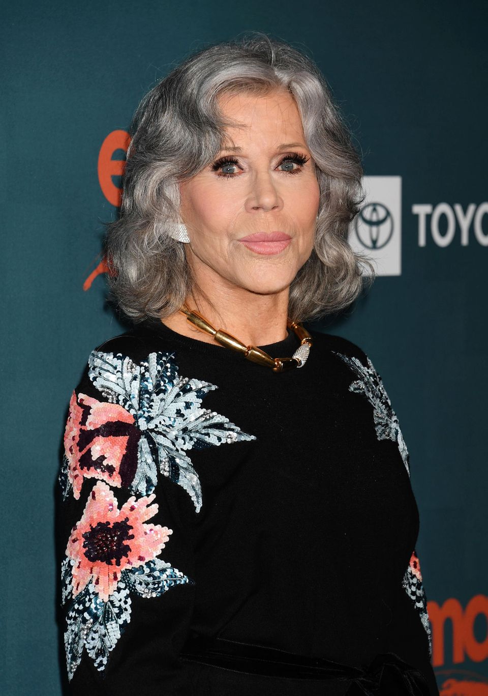 Jane Fonda wears her shoulder-length bob in big curls.  Layered hair falls slightly over her face, making the style appear looser.