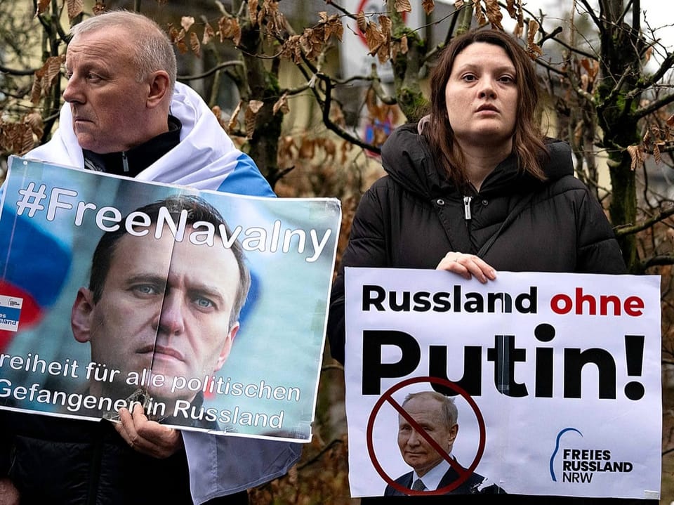 Protesters gather in front of the Russian Consulate General after the death of Alexei Navalny.